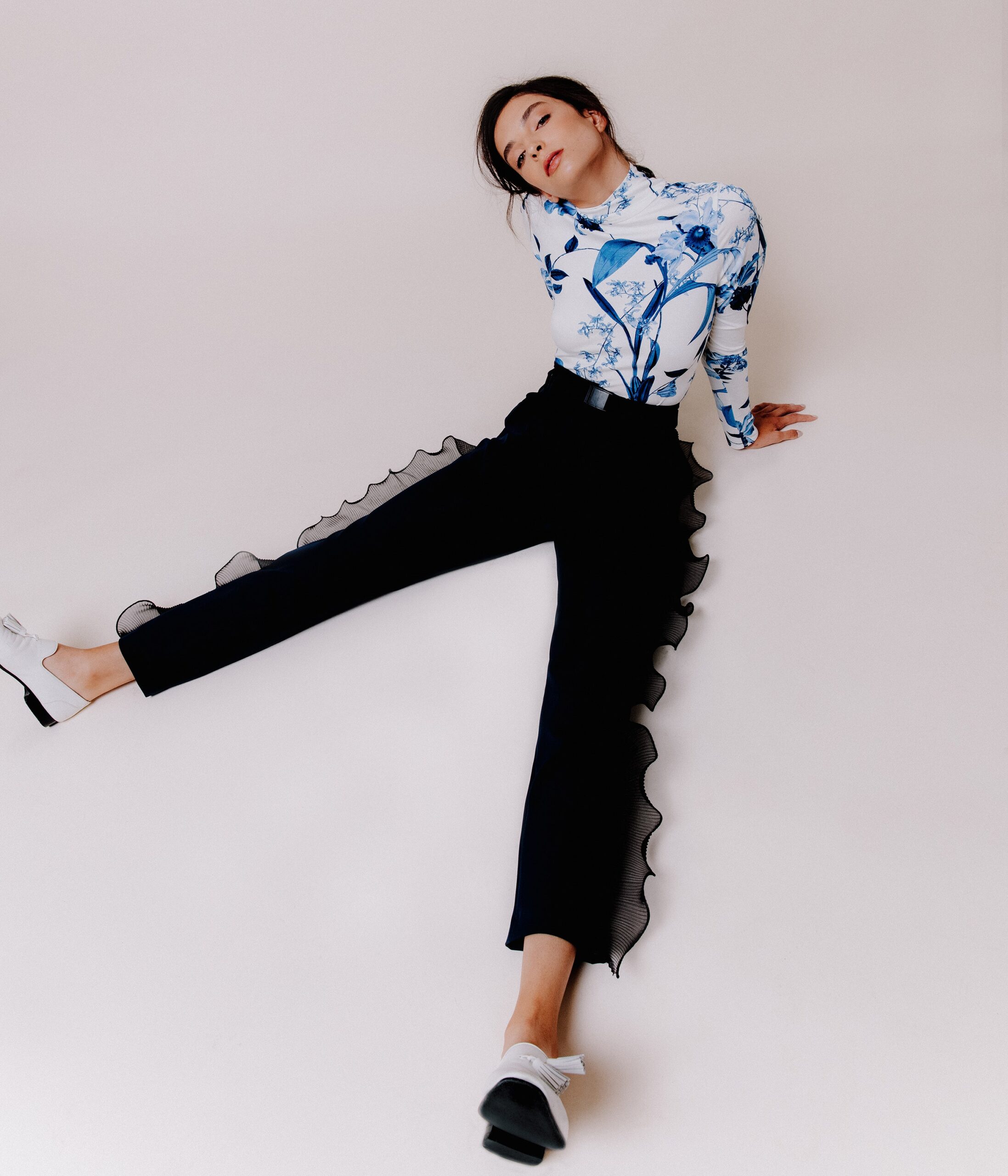 fitted white blue printed top and black flared pants