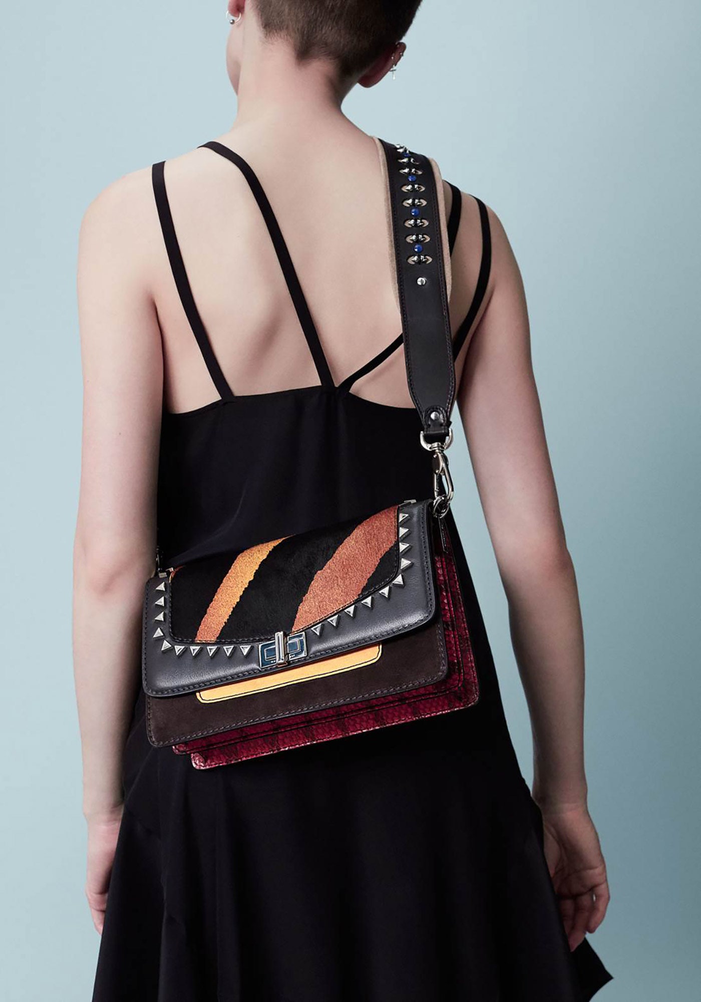black midi dress with embellished bag