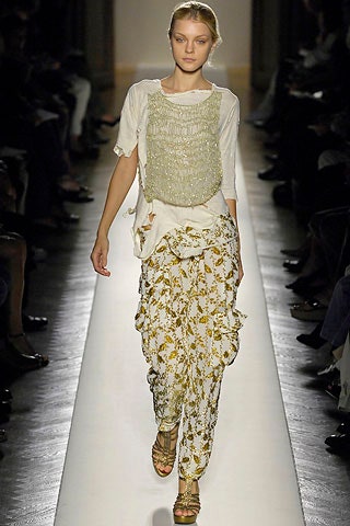 white relaxed top with flared pants