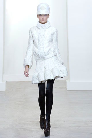 white fitted jacket and skirt