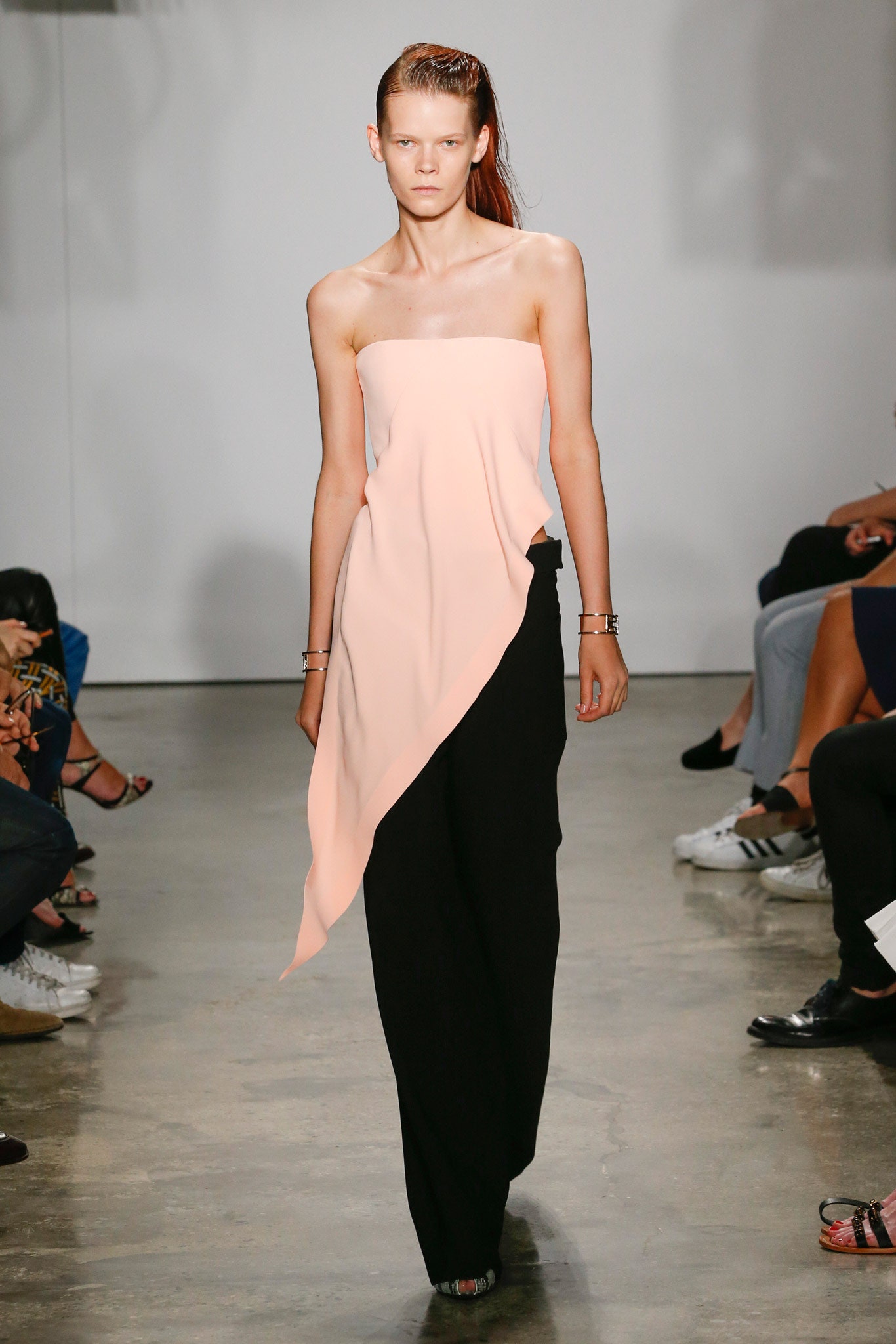 pink strapless top with black pants