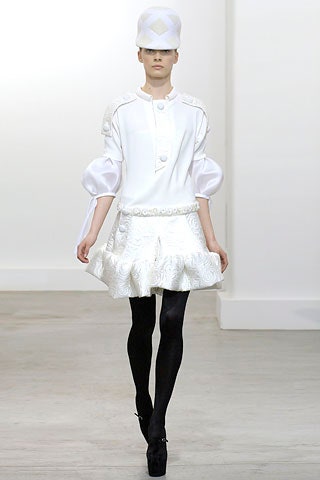 white silk blouse and mini skirt