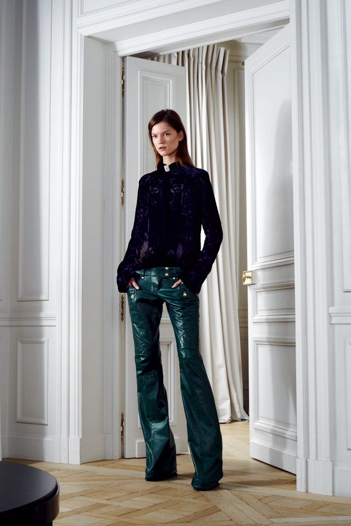 green leather fitted flared shiny pants