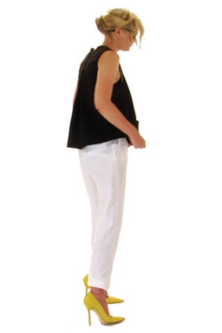 black oversized top with white pants