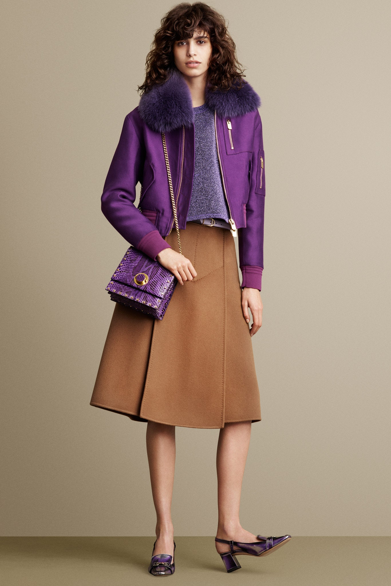 purple jacket gray top brown skirt
