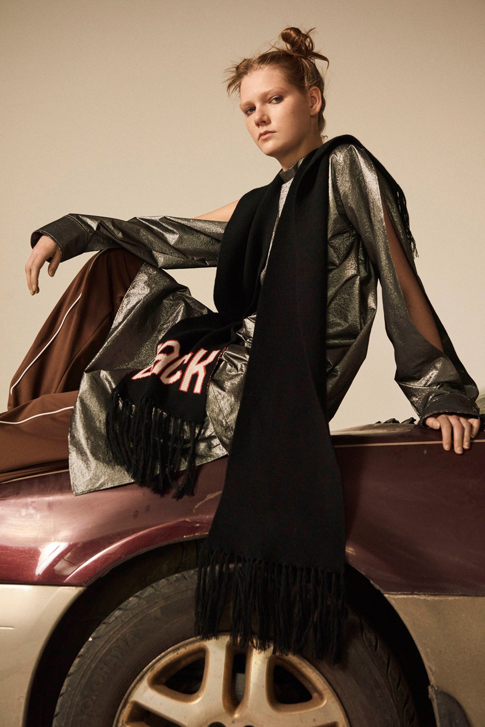 metallic coat with black scarf