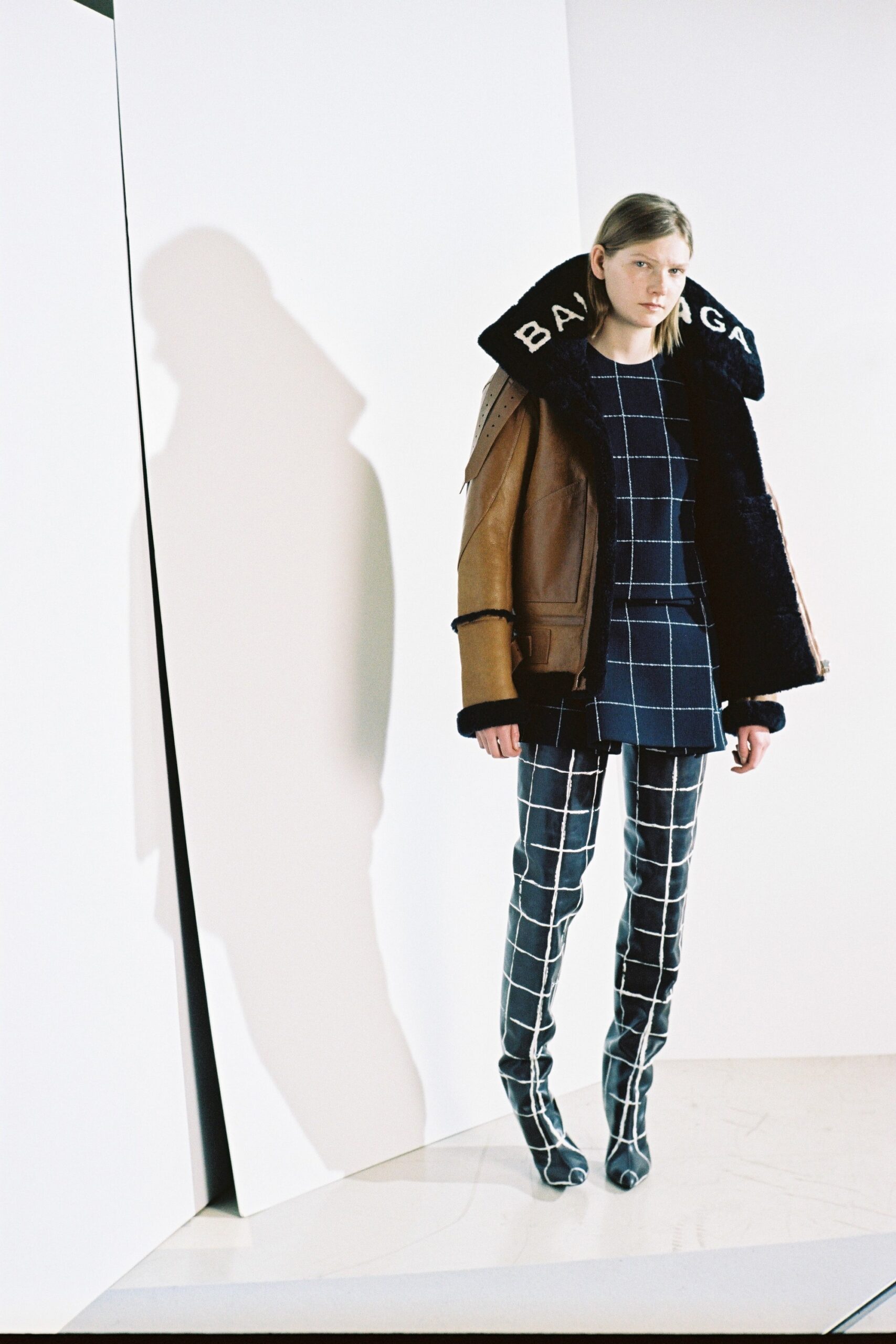 brown leather jacket with checked top and pants
