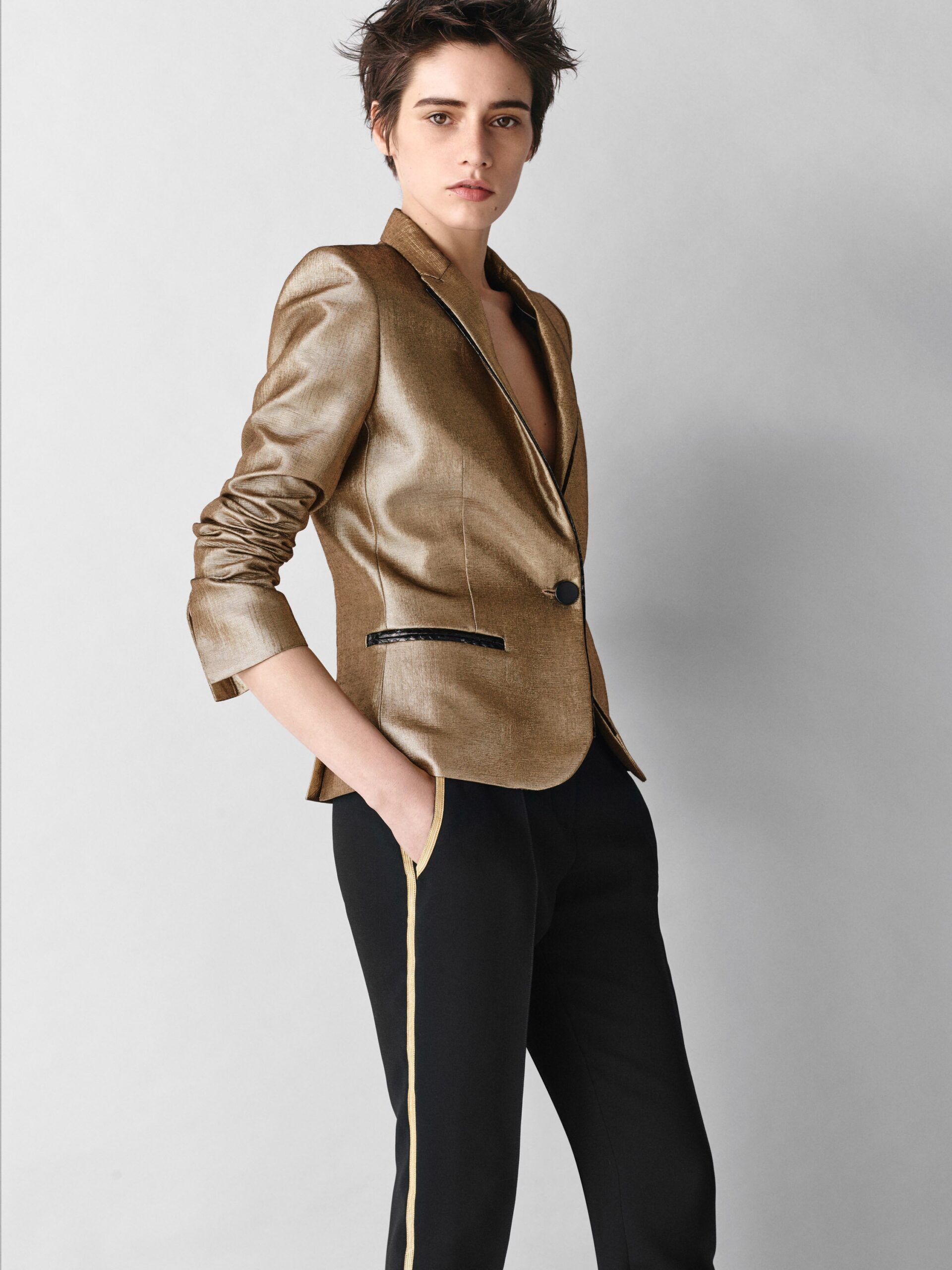 gold metallic tailored blazer and black pants