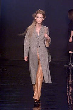 gray wool coat and beige leather pants