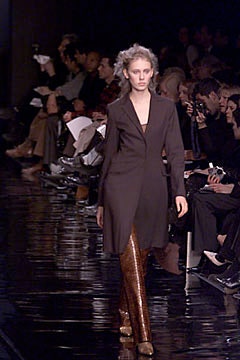 brown tailored coat with gold pants