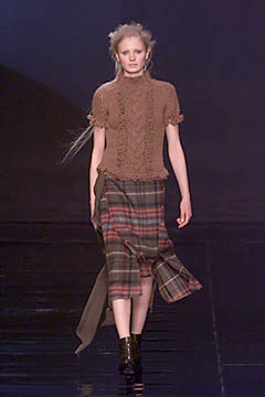 brown knitted top with plaid skirt