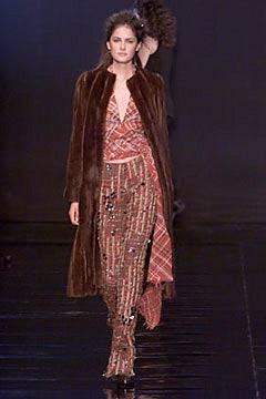 brown fur coat and red silk dress