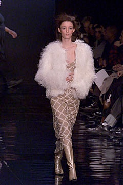 beige fitted dress with white faux-fur jacket