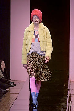 yellow faux-fur jacket with animal-print skirt