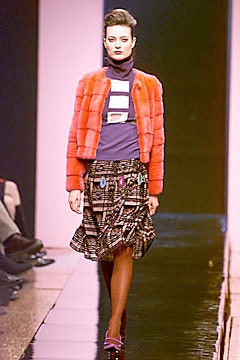 pink faux-fur jacket with purple top and flared skirt