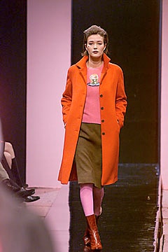 orange coat pink top brown skirt