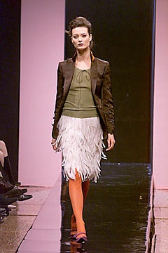 brown blazer green top white feathered skirt