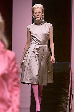 gray silk sleeveless dress with pink tights