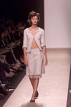 beige fitted cardigan and skirt