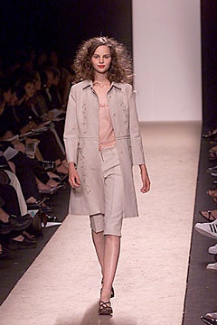 beige coat with pink top and shorts