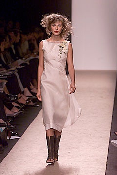 white silk fitted dress with black boots
