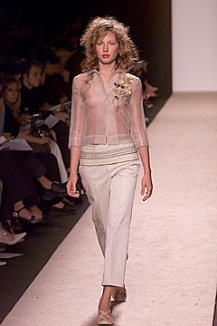 white sheer blouse with beige pants