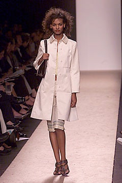 white relaxed coat and fitted skirt