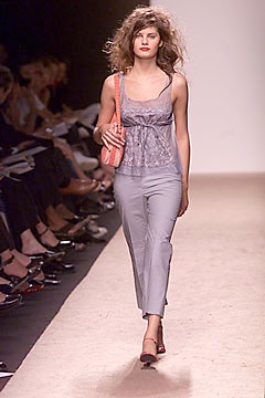 gray silk top with slim pants