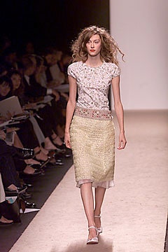 white embroidered top with beige skirt
