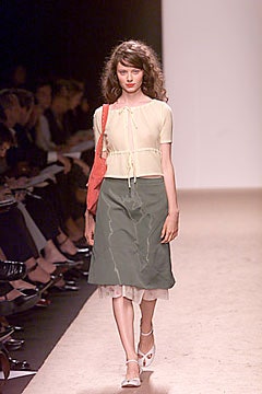 white fitted top and green skirt