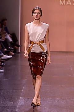 beige silk sleeveless top and brown vinyl pencil skirt