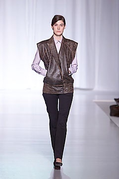 brown leather fitted vest with purple shirt