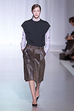 black top and brown leather skirt