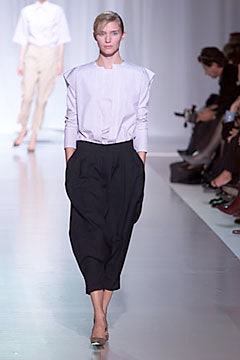 white relaxed blouse black pants