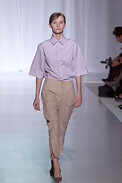 purple relaxed shirt and beige fitted pants
