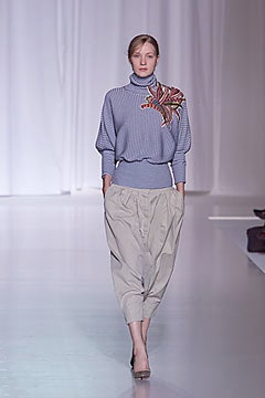 gray relaxed sweater with beige pants