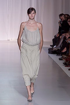gray silk top with beige pants