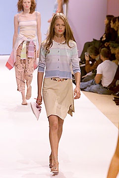 blue striped cardigan and beige skirt