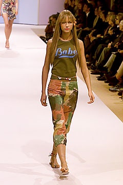 green fitted top with multi cargo pants