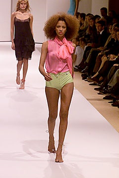 pink sleeveless top and green shorts