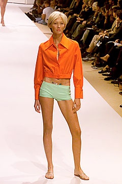 fitted orange jacket with green shorts