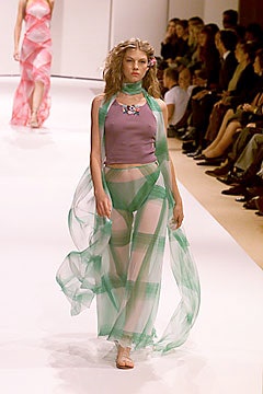 purple silk top with green pants