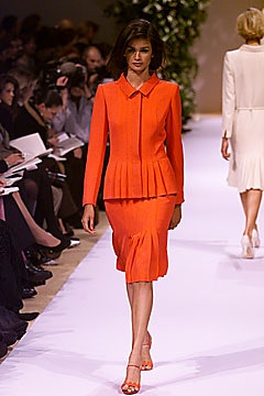 orange fitted blazer and skirt