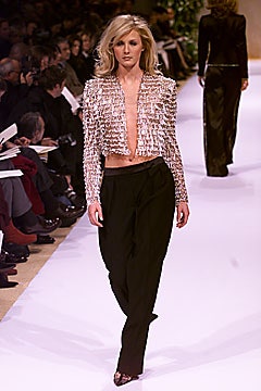 pink ruffled jacket with black pants