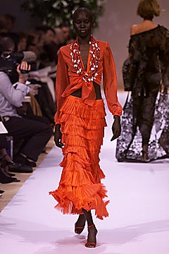 orange ruffled top and skirt