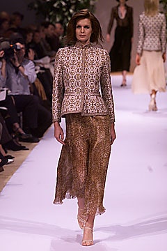 beige printed jacket with gold skirt