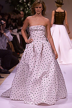 white polka-dot strapless gown