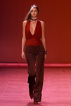 red silk sleeveless top and brown flared pants