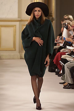 green wool cape with black hat