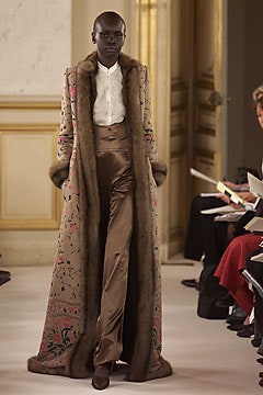 beige fur coat with silk blouse